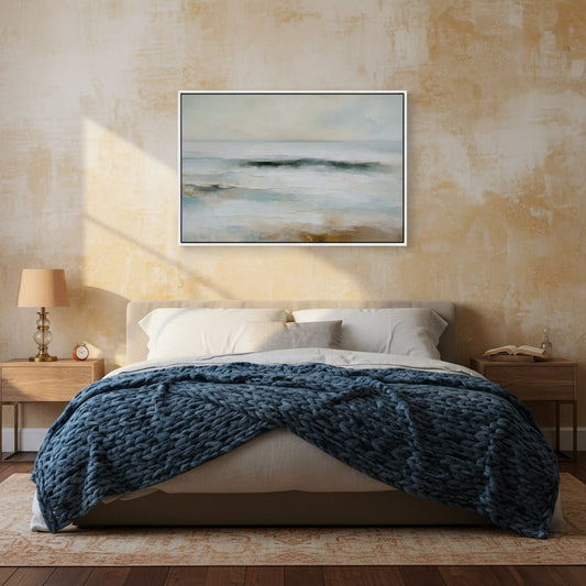 Bedroom with abstract painting above bed and nightstands on either side