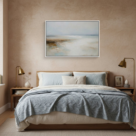 Bedroom with a bed, nightstands, lamps, and a framed landscape painting on the wall.