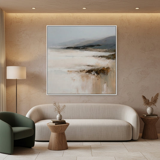 Modern living room with a beige sofa, green armchair, and abstract painting on the wall.