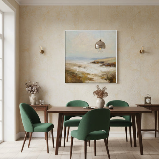 Dining room with wooden table and green chairs, featuring a coastal painting on the wall.