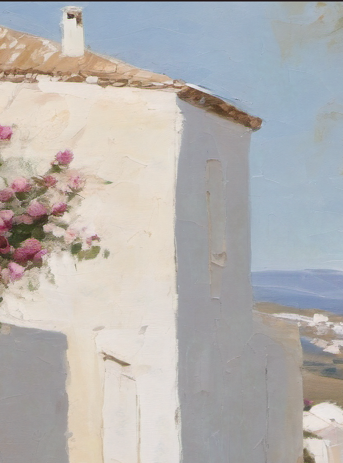 White building with pink flowers against a blue sky