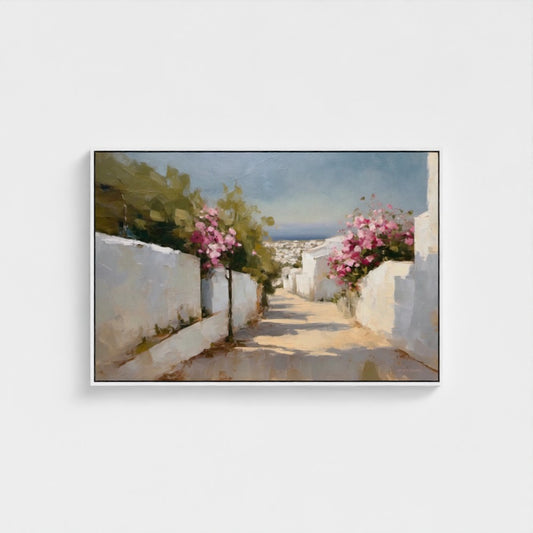 Framed artwork of a scenic street with white walls and pink flowers on a white background
