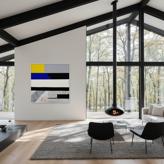 Modern living room with abstract art, chairs, and a fireplace.