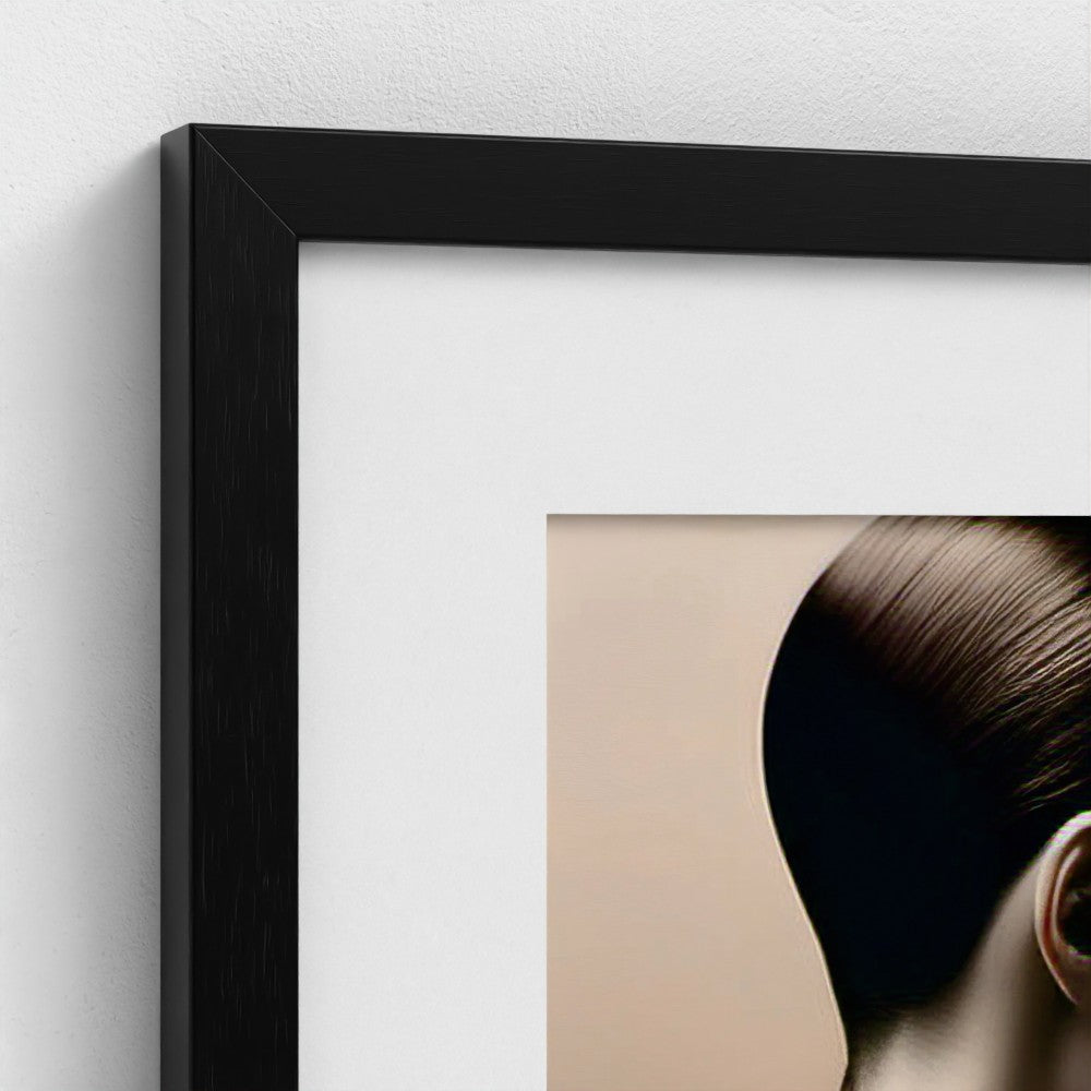 Framed artwork of a person with dark hair on a white wall