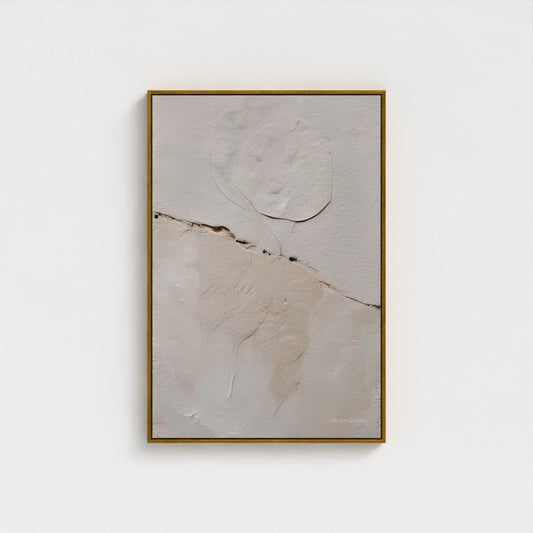 Abstract art piece with a gold frame on a white background