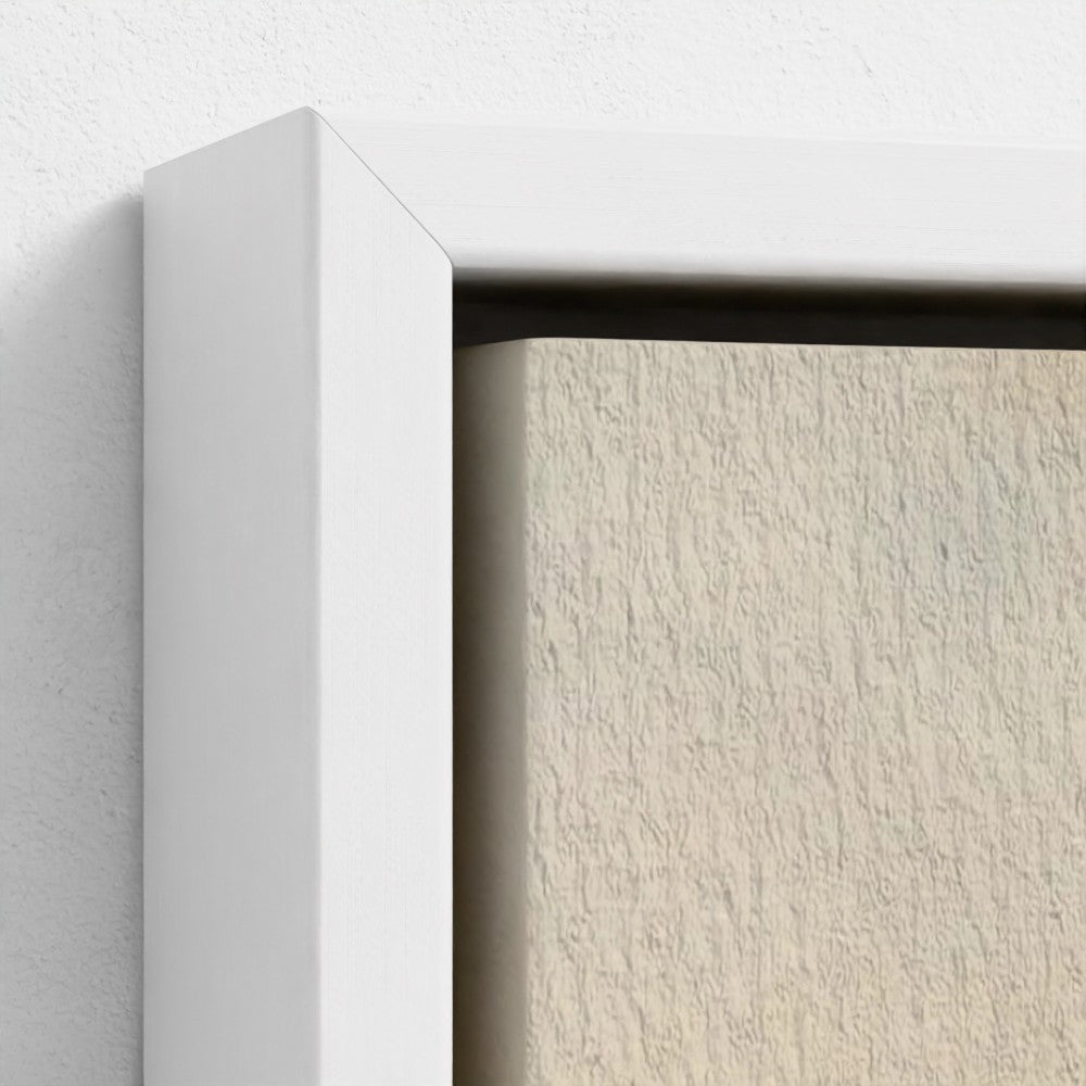 Close-up of a white frame corner on a textured beige wall.