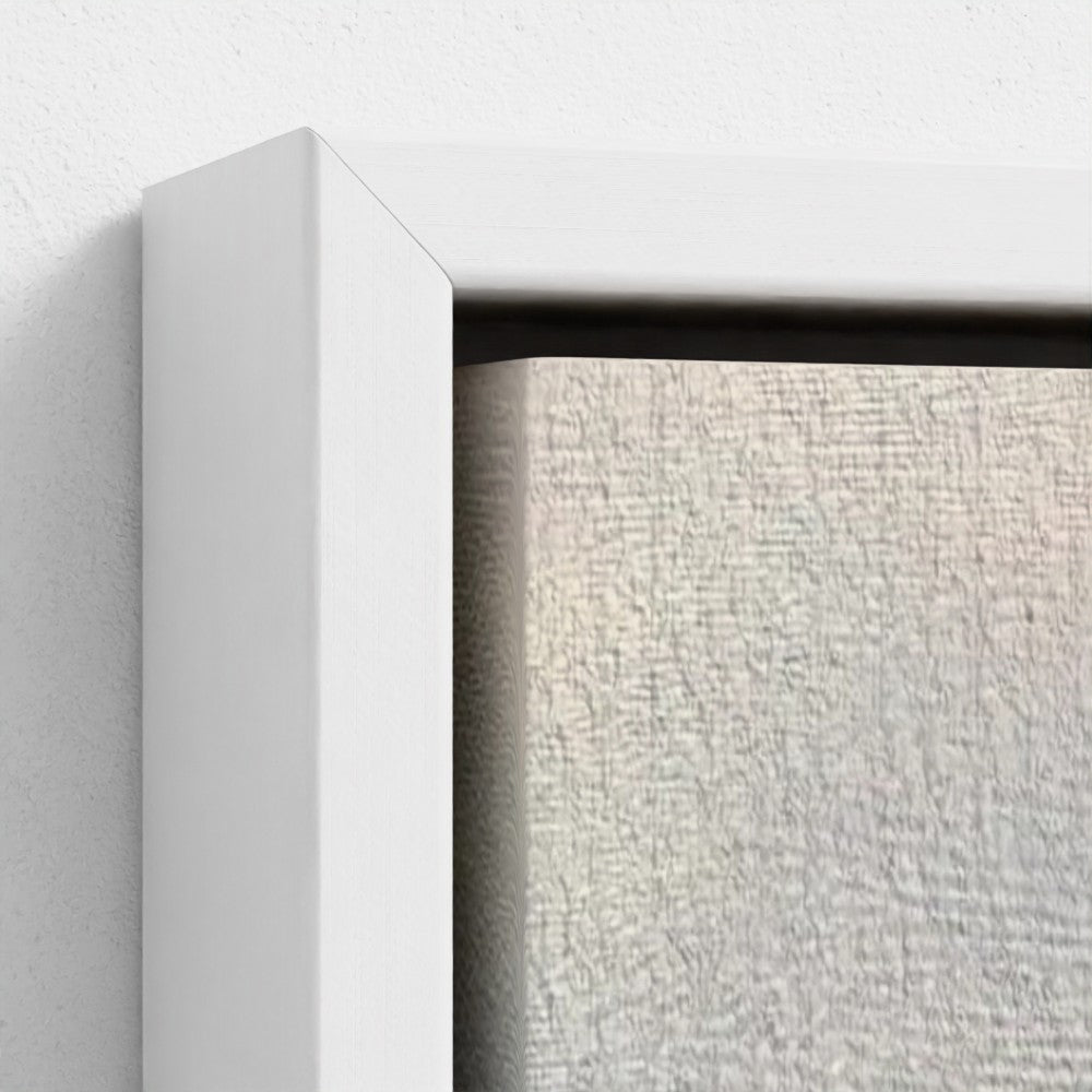 Close-up of a white frame corner with a textured gray background