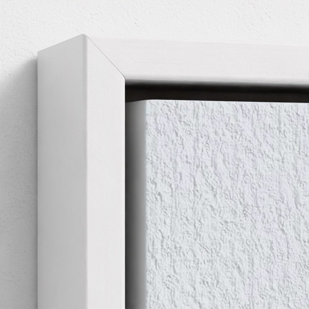 Close-up of a white frame corner on a textured white wall