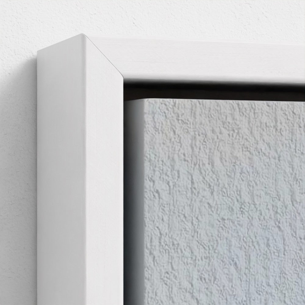 Close-up of a white frame corner on a textured white background