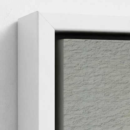 Close-up of a textured gray wall with a white frame corner.