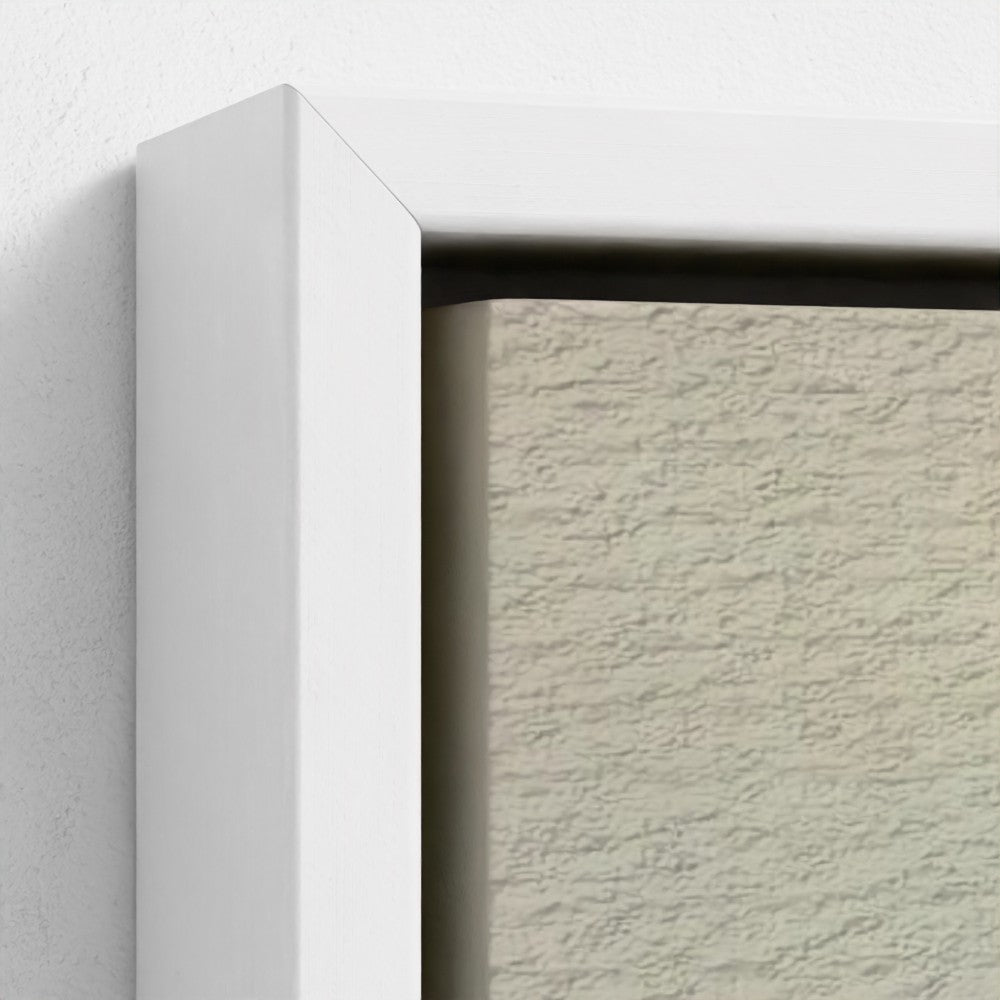 Close-up of a textured wall with a white frame.