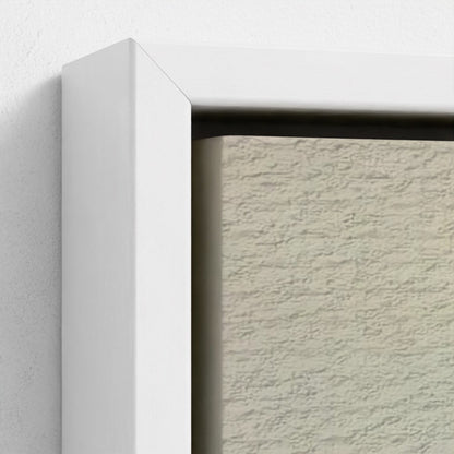Close-up of a textured wall with a white frame.