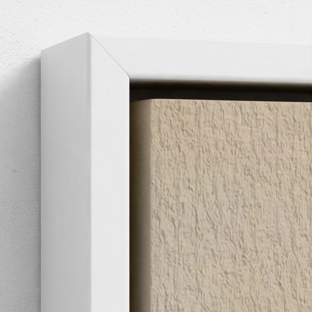 Close-up of a textured wall with a white frame corner.