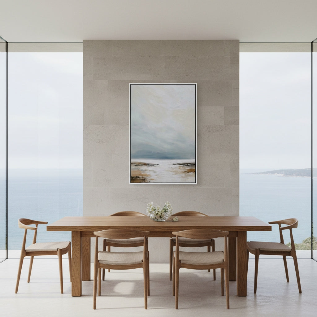 Dining room with wooden table and chairs, abstract painting on wall, and large windows.