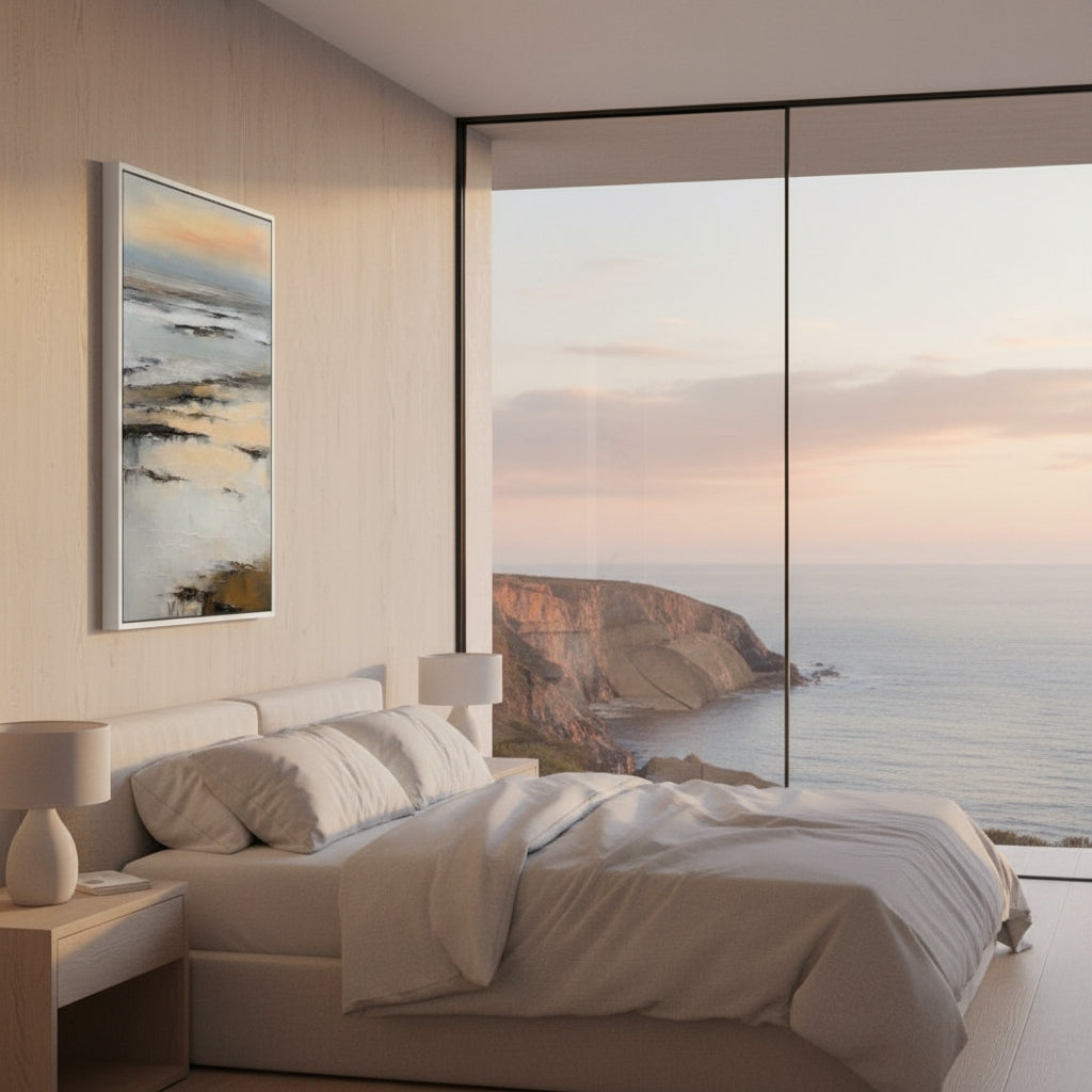 Modern bedroom with a large window view of a coastal landscape