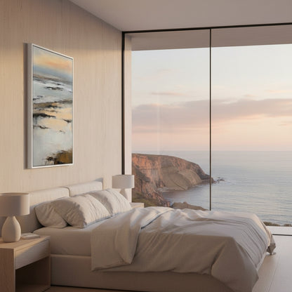 Modern bedroom with a large window view of a coastal landscape