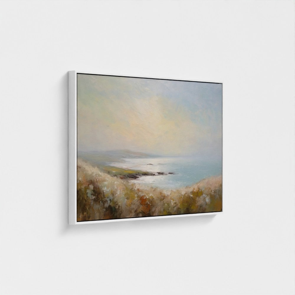 Framed painting of a coastal landscape with a body of water and hills.