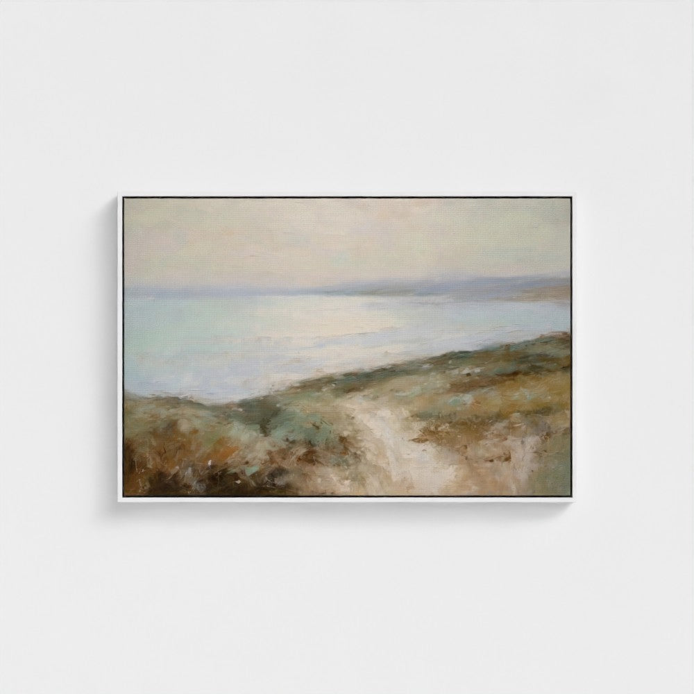 Framed painting of a landscape with a path and fields on a white wall