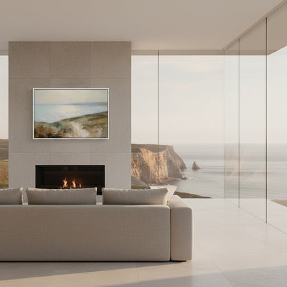 Modern living room with a fireplace and wall art depicting a coastal scene.