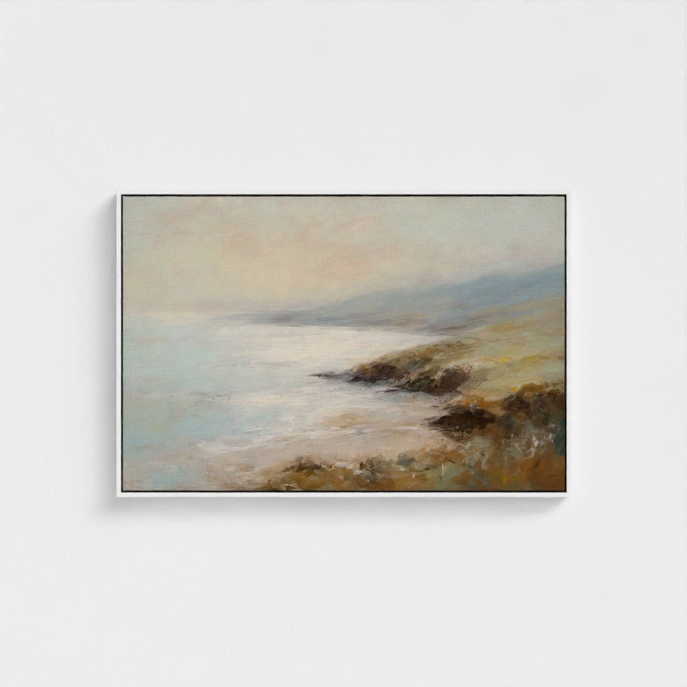 Framed painting of a coastal landscape with a body of water and land.