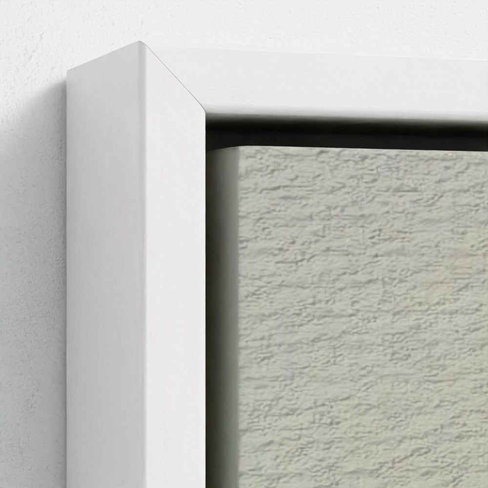 Close-up of a textured wall with a white frame corner.