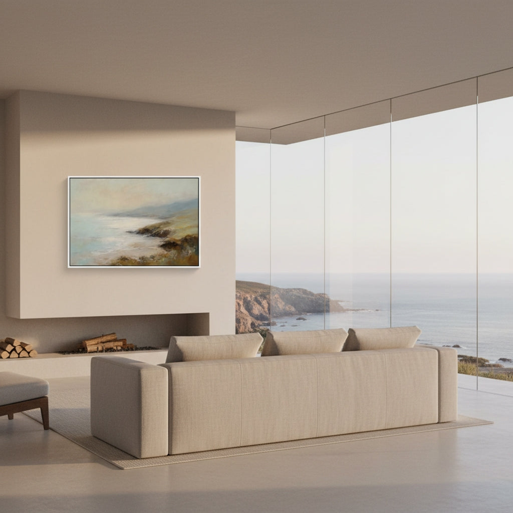 Modern living room with a large sofa, wall art, and a scenic view.