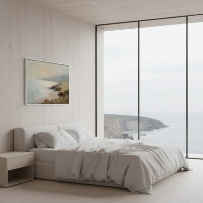 Modern bedroom with a large window view of a coastal landscape.