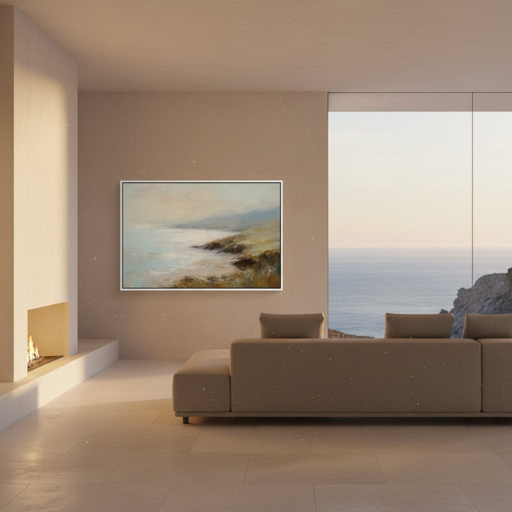 Modern living room with a painting of a coastal scene on a beige wall.