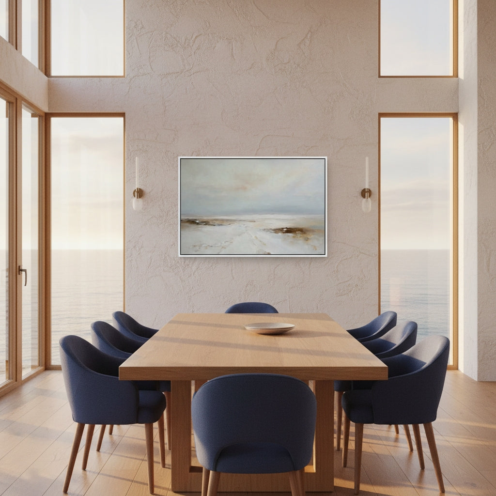 Modern dining room with wooden table and blue chairs, featuring a framed landscape painting on the wall.