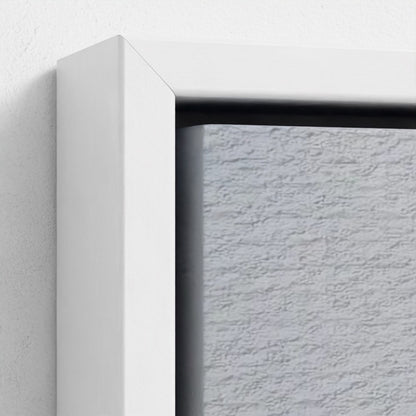 Close-up of a textured wall with a white frame corner.