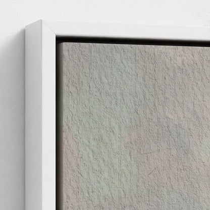 Close-up of a textured wall with a white frame.