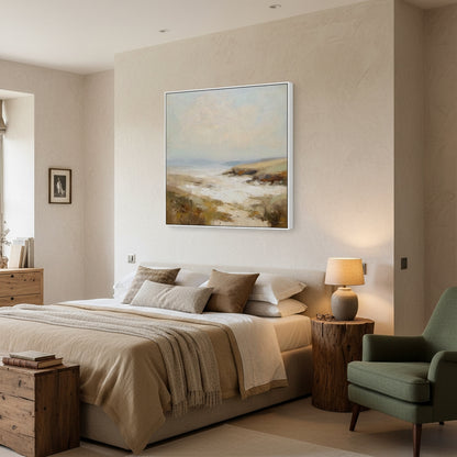 Modern bedroom with a bed, lamp, and artwork on the wall.