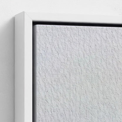 Close-up of a textured white wall with a black frame corner.