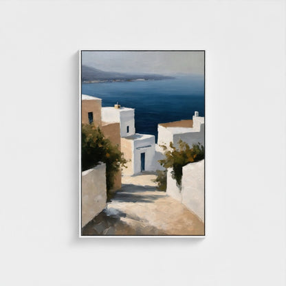 Framed artwork of a coastal scene with white buildings and blue sea.