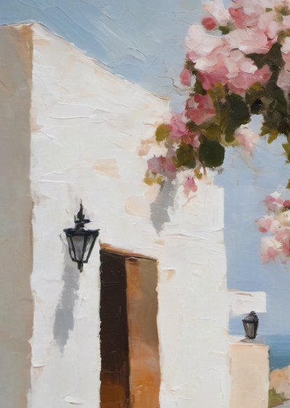 White building with a door and black lantern, decorated with pink flowers against a blue sky.