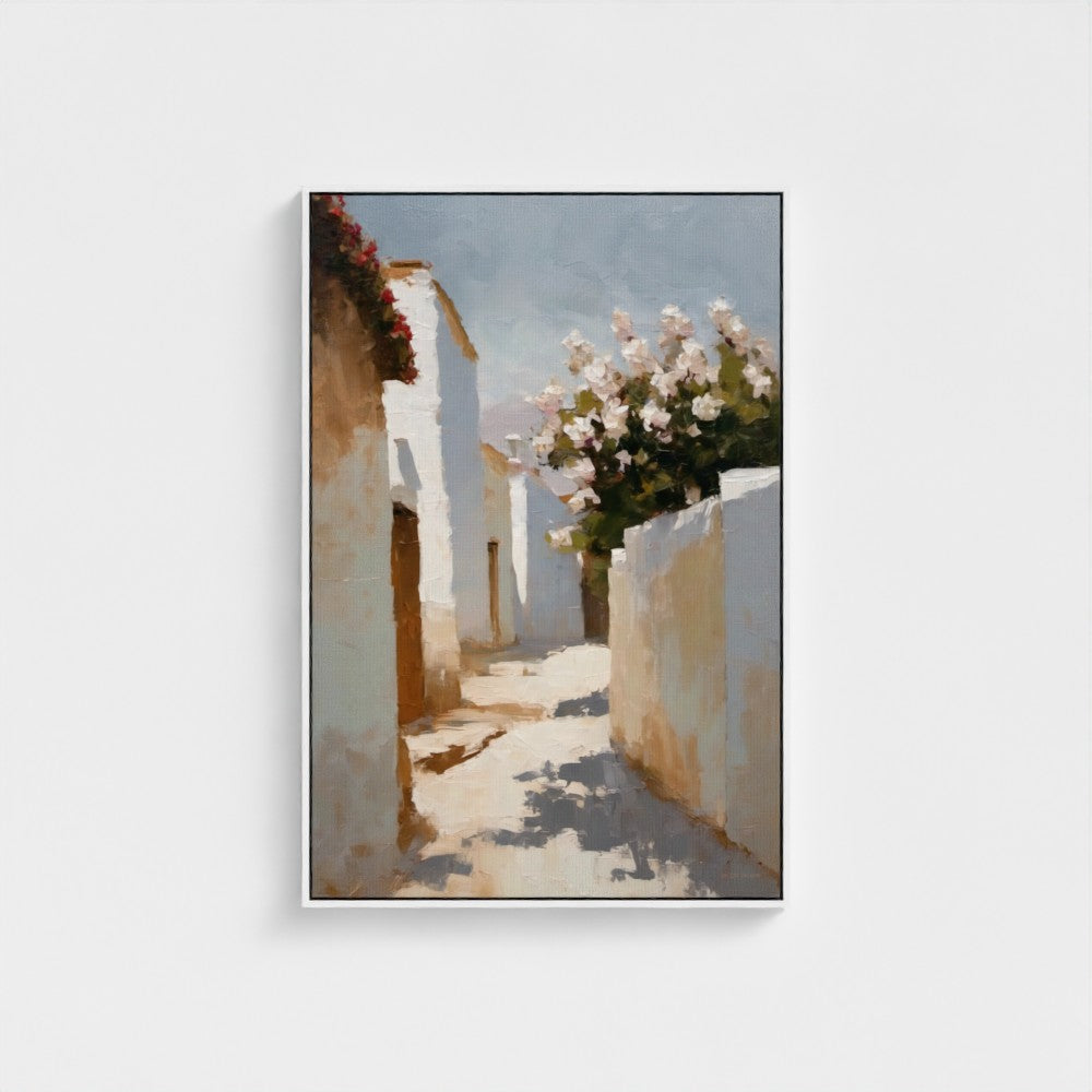 Framed artwork of a sunlit alleyway with white walls and flowers.