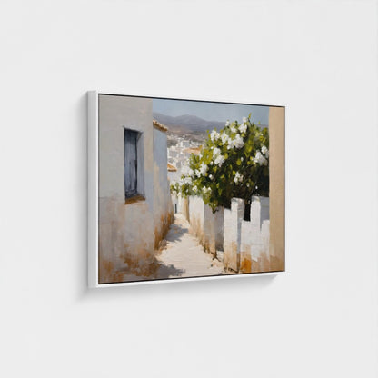 Framed artwork of a scenic view with a building and flowers on a white wall