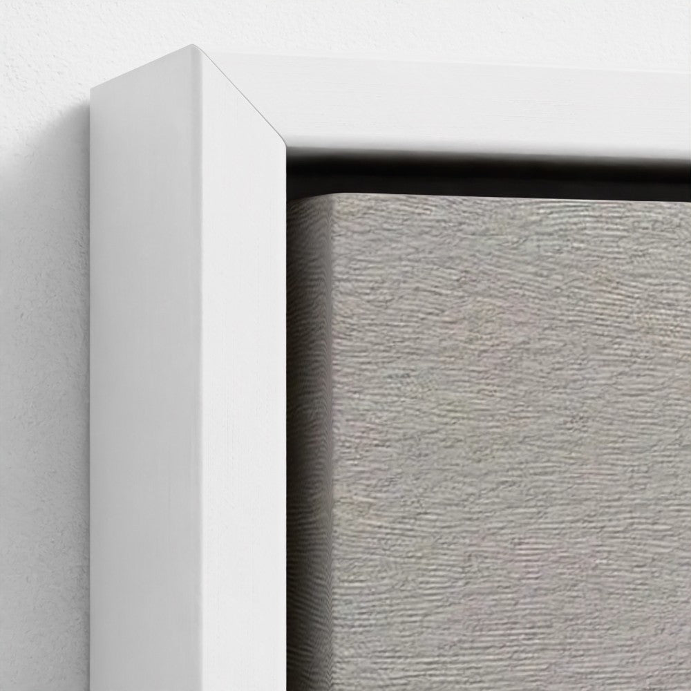 Close-up of a white frame corner with a textured gray background