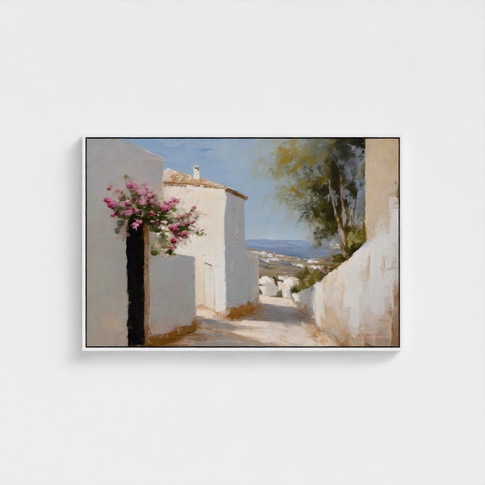 Framed artwork of a coastal scene with white buildings and pink flowers.