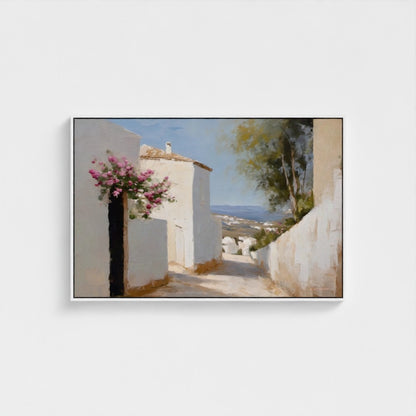 Framed artwork of a coastal scene with white buildings and pink flowers.