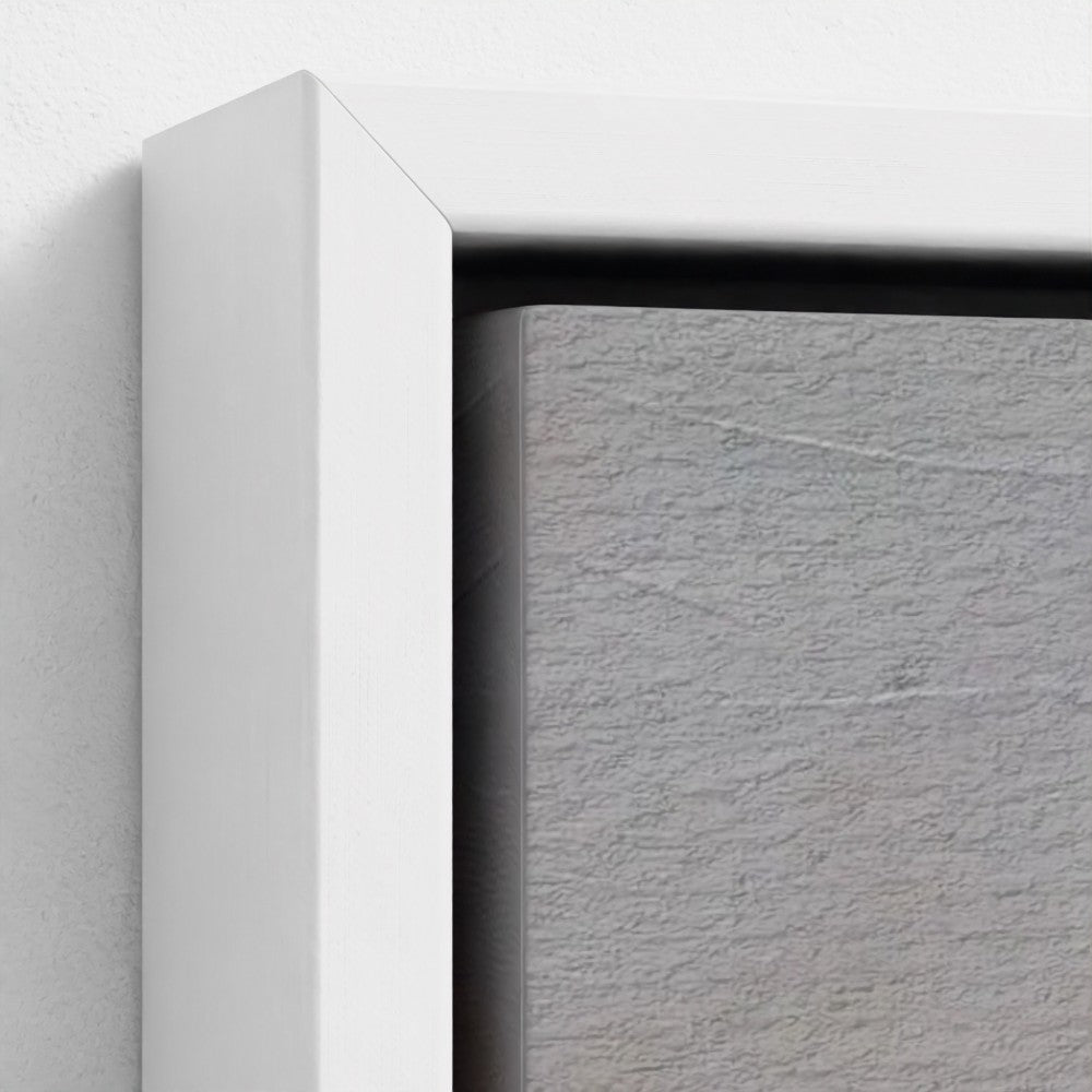 Close-up of a white frame corner with a textured gray background