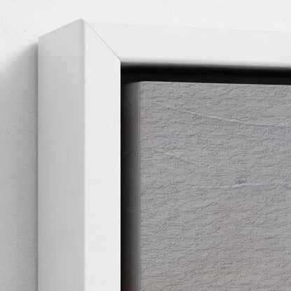 Close-up of a white frame corner with a textured gray background