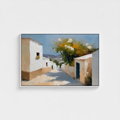 Framed painting of a sunlit street with white buildings and greenery.