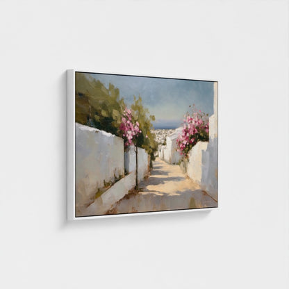 Framed artwork of a scenic street with white walls and pink flowers on a white background