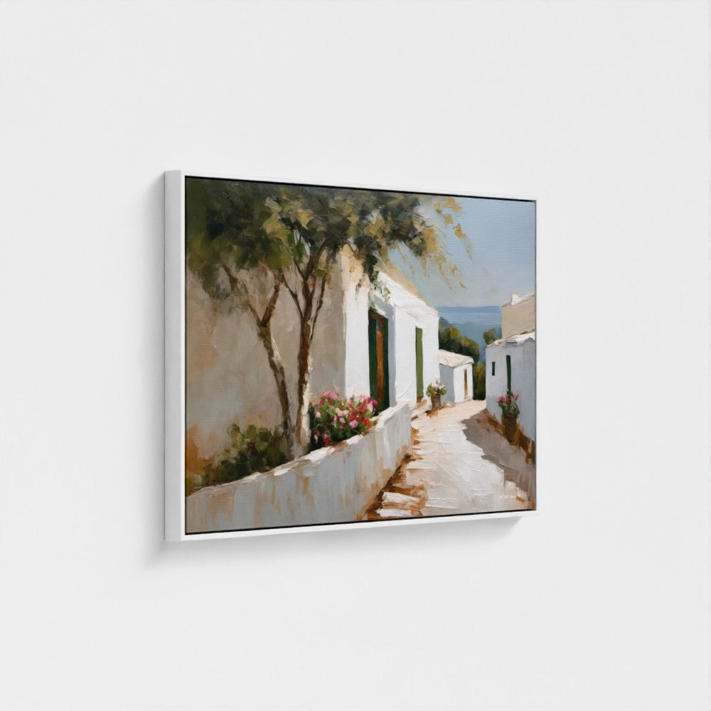 Framed painting of a Mediterranean street scene with white buildings and greenery.