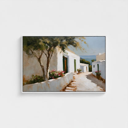 Framed painting of a Mediterranean scene with white buildings and greenery.