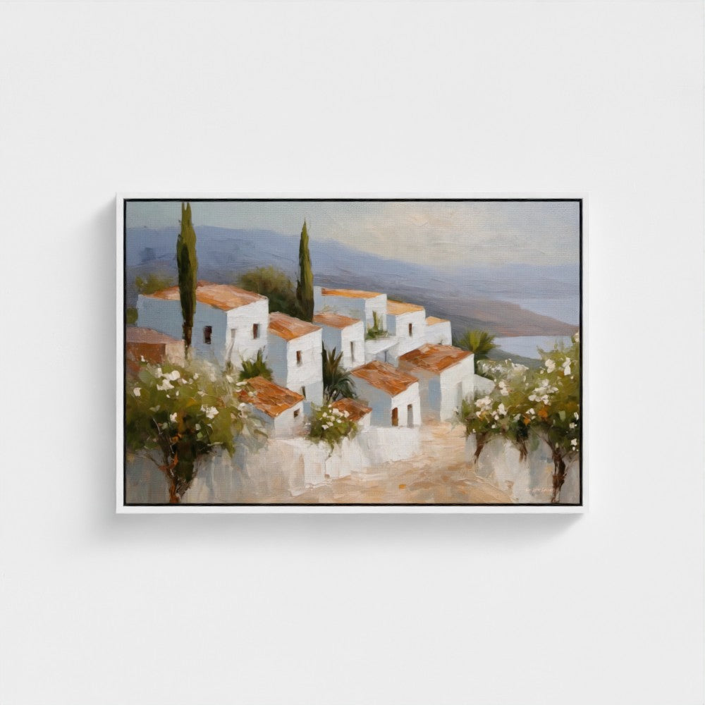 Framed painting of a coastal village scene with white houses and greenery.