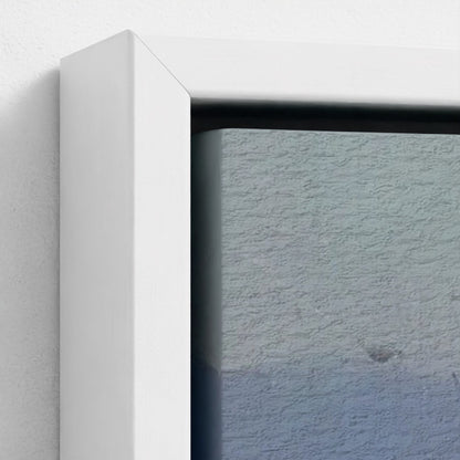 Close-up of a white frame corner with a textured blue wall background