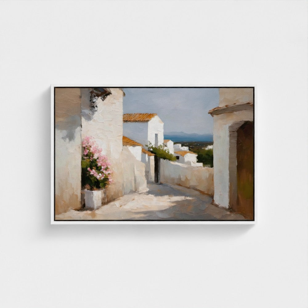 Framed artwork of a coastal scene with white buildings and pink flowers.