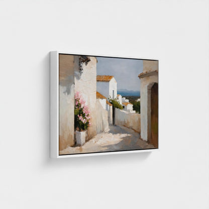 Framed artwork of a coastal scene with white buildings and pink flowers.